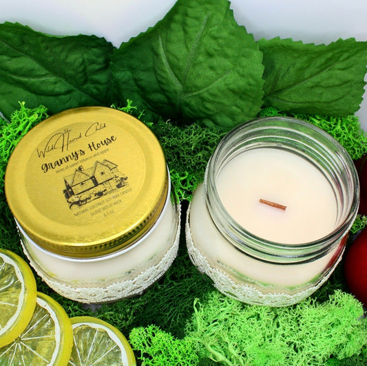 Coconut soy wax wood wick mason jar candles from The Wild Haired Child scented in Granny’s house, a blend of pear, redwood, apple, lemon, and sweet tobacco. 6.5 ounce size.